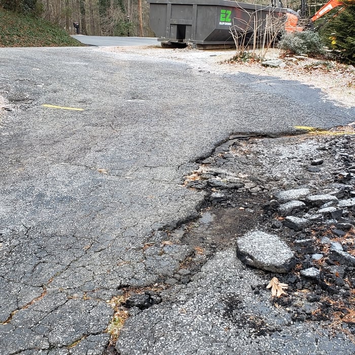 250' of crumbling driveway