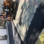 Machine laying hot asphalt